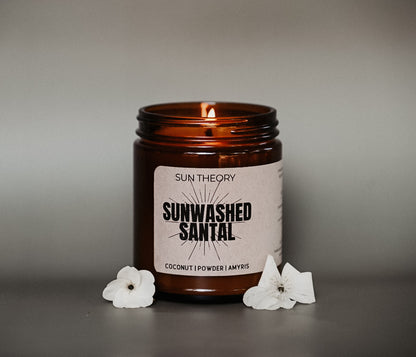 amber-colored candle labled 'sunwashed santal'