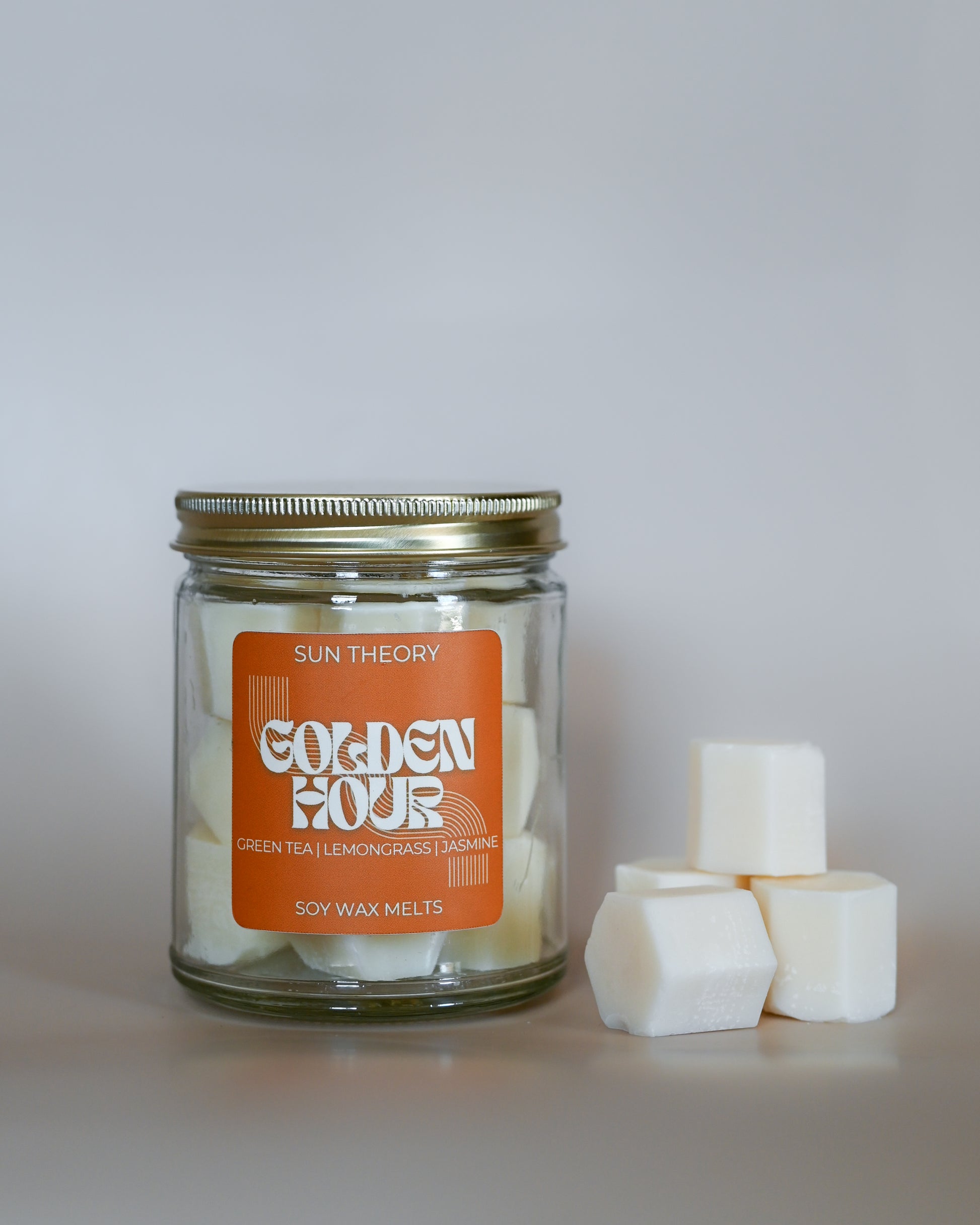 Jar of Sun Theory Golden Hour soy wax melts on a white background