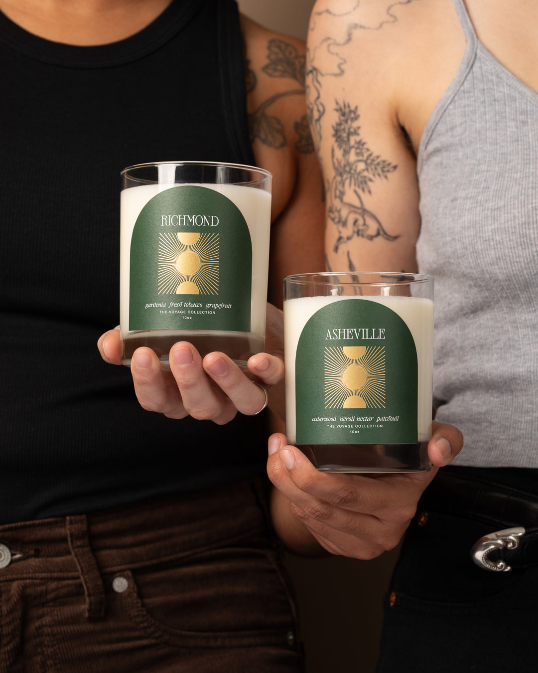 Two people holding candles labeled 'Richmond' and 'Asheville'.