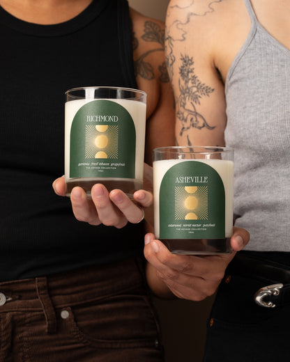 Two people holding candles labeled 'Richmond' and 'Asheville'.