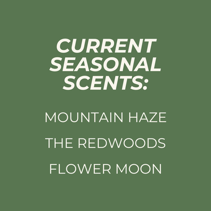 Text on a green background listing current seasonal scents: Mountain Haze, The Redwoods, and Flower Moon.