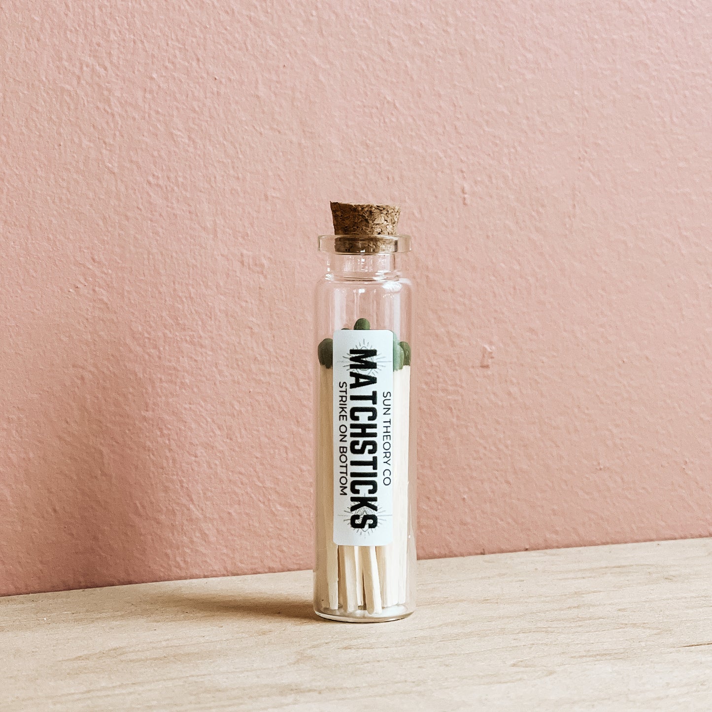 glass jar of matchsticks standing up