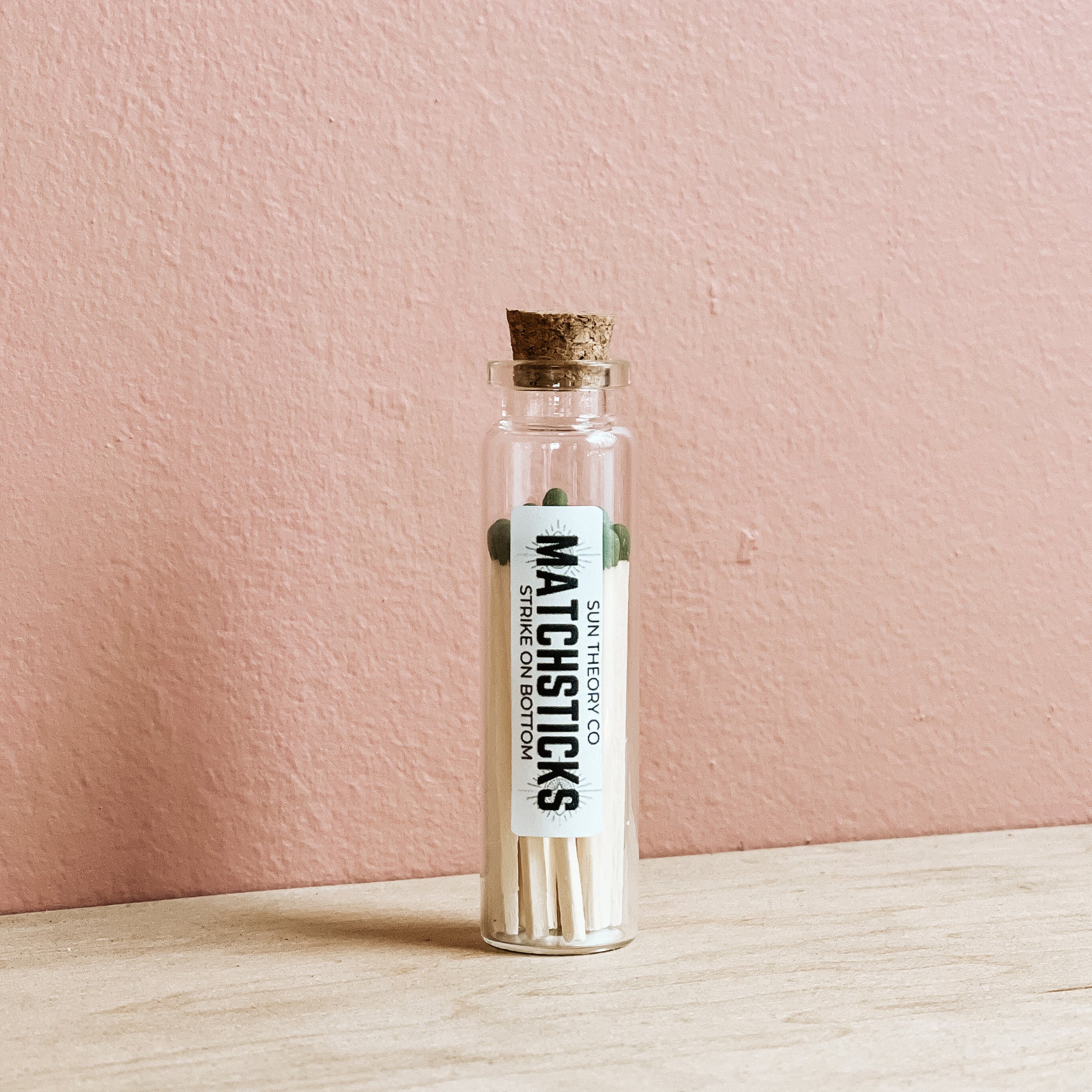 glass jar of matchsticks standing up