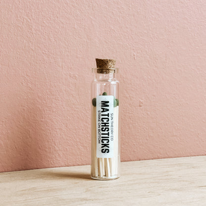 glass jar of matchsticks standing up